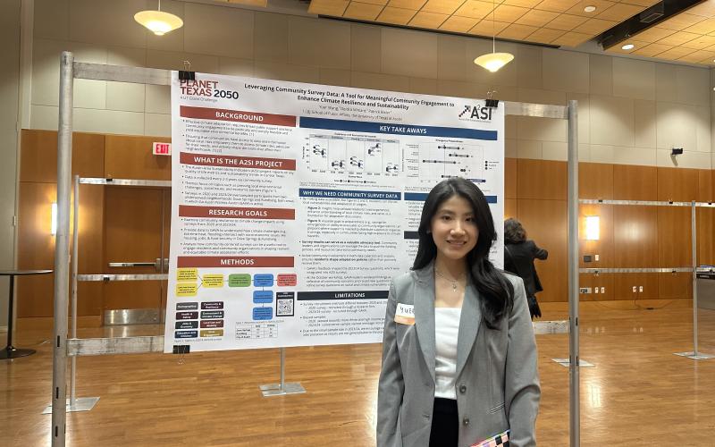 student presenting research poster